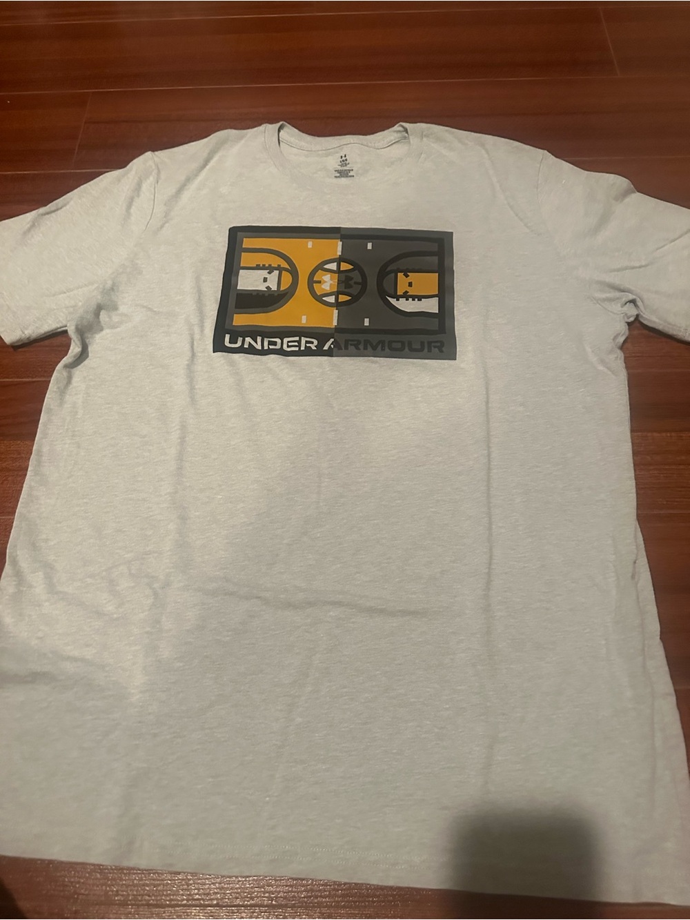 Under Armour Men’s Light Gray Graphic Logo Tee with Yellow and Black Accent